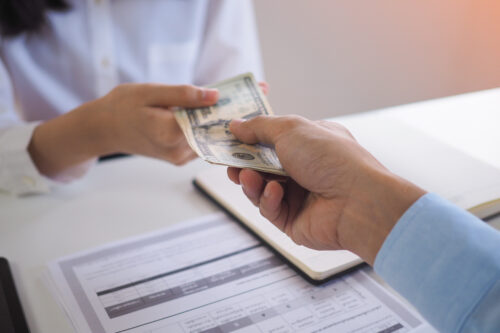 hands exchanging money